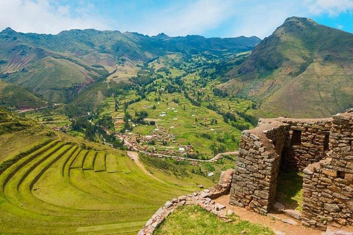 a view of a valley with mountains in the background