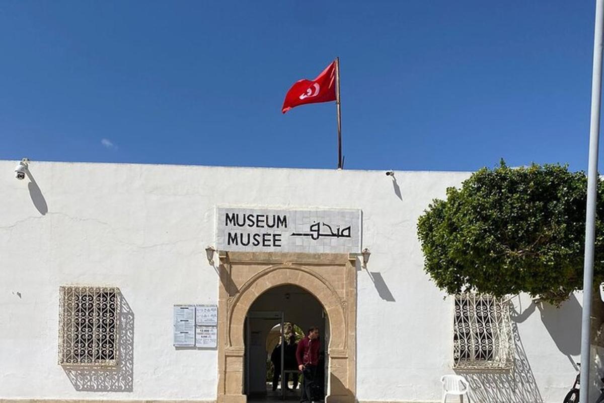 a flag flying over the entrance to a museum of music