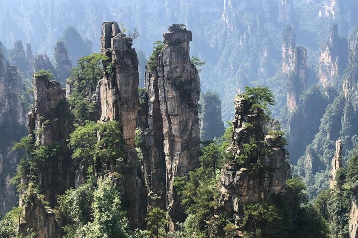a group of tall rocks in the mountains