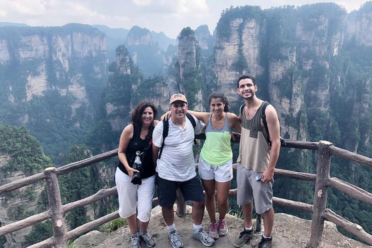 a group of people standing on top of a mountain
