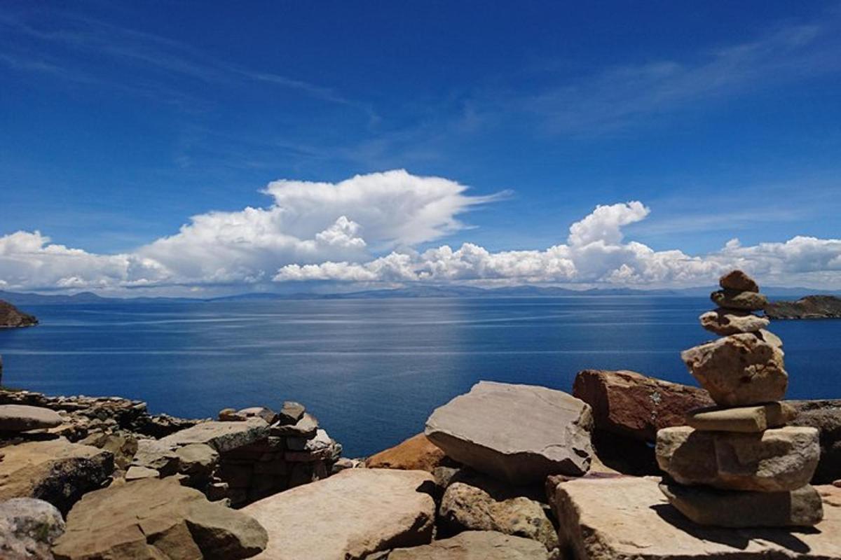 a stack of rocks on top of a body of water