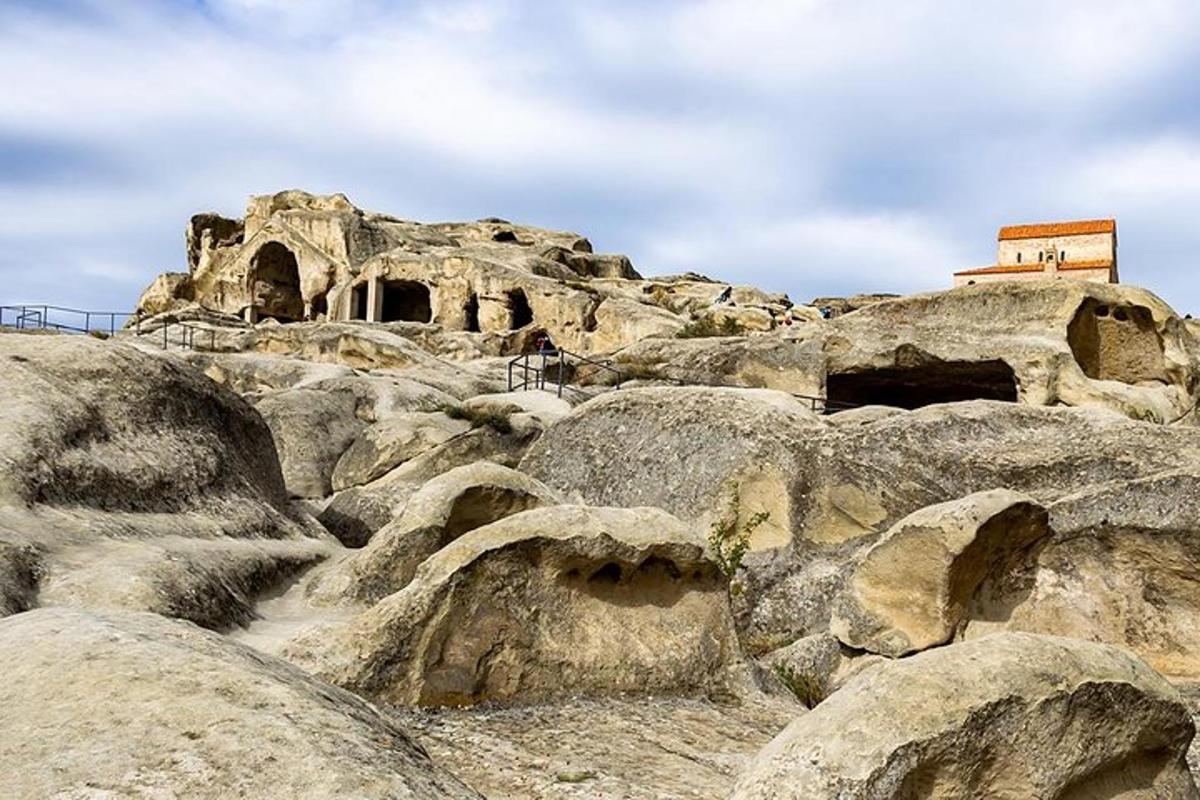 a bunch of rocks with a building on top of it
