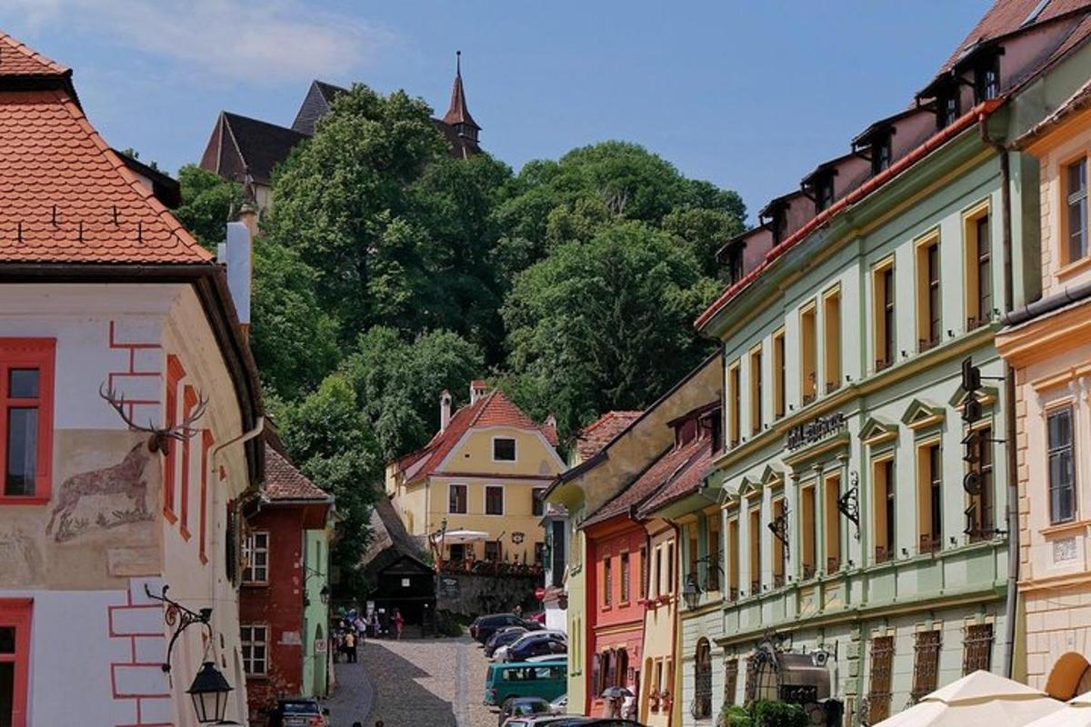 a view of a street in a town with buildings