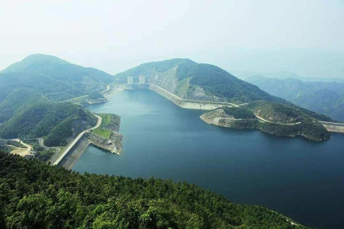 an aerial view of a bridge over a body of water