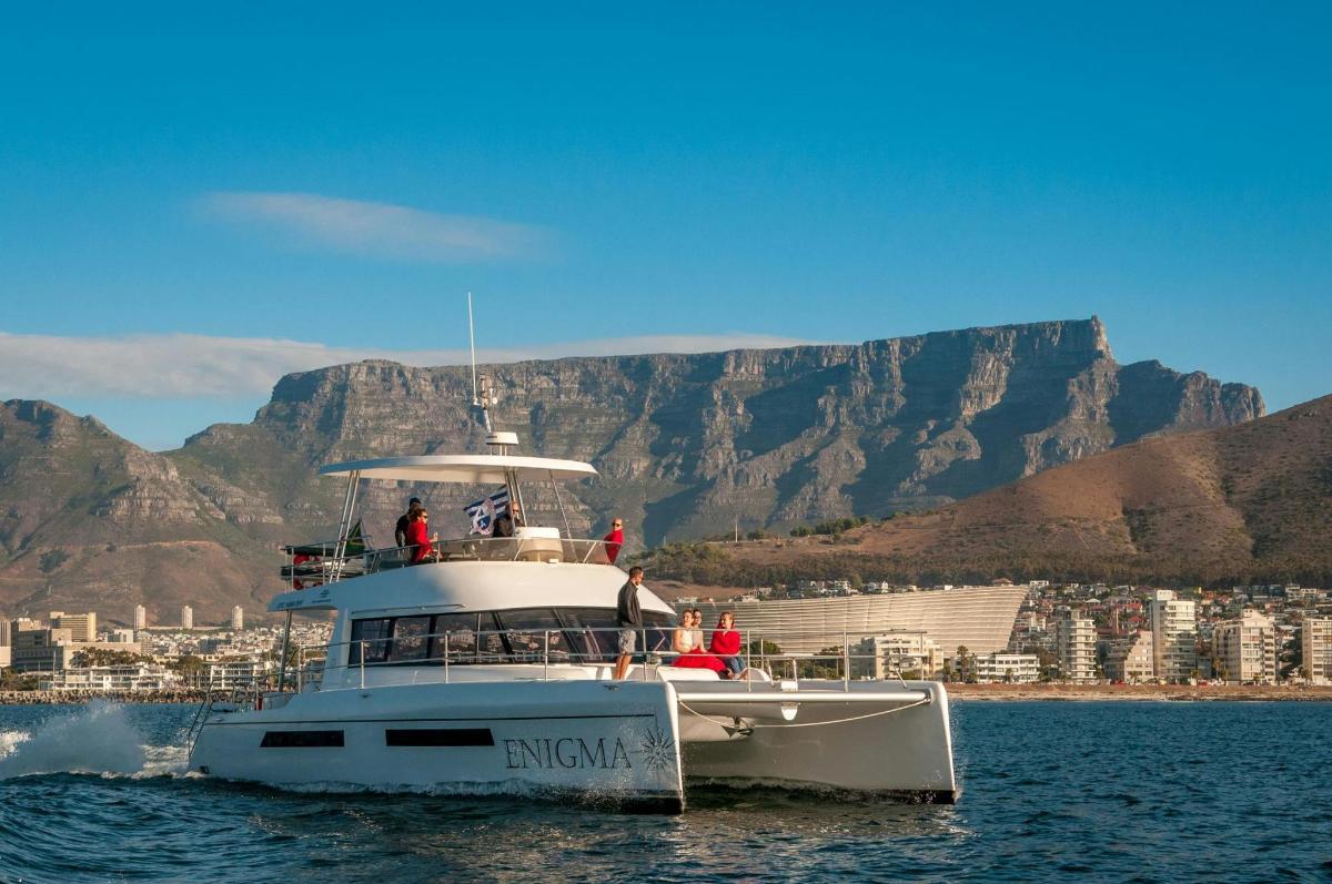 a boat in the water with mountains in the background