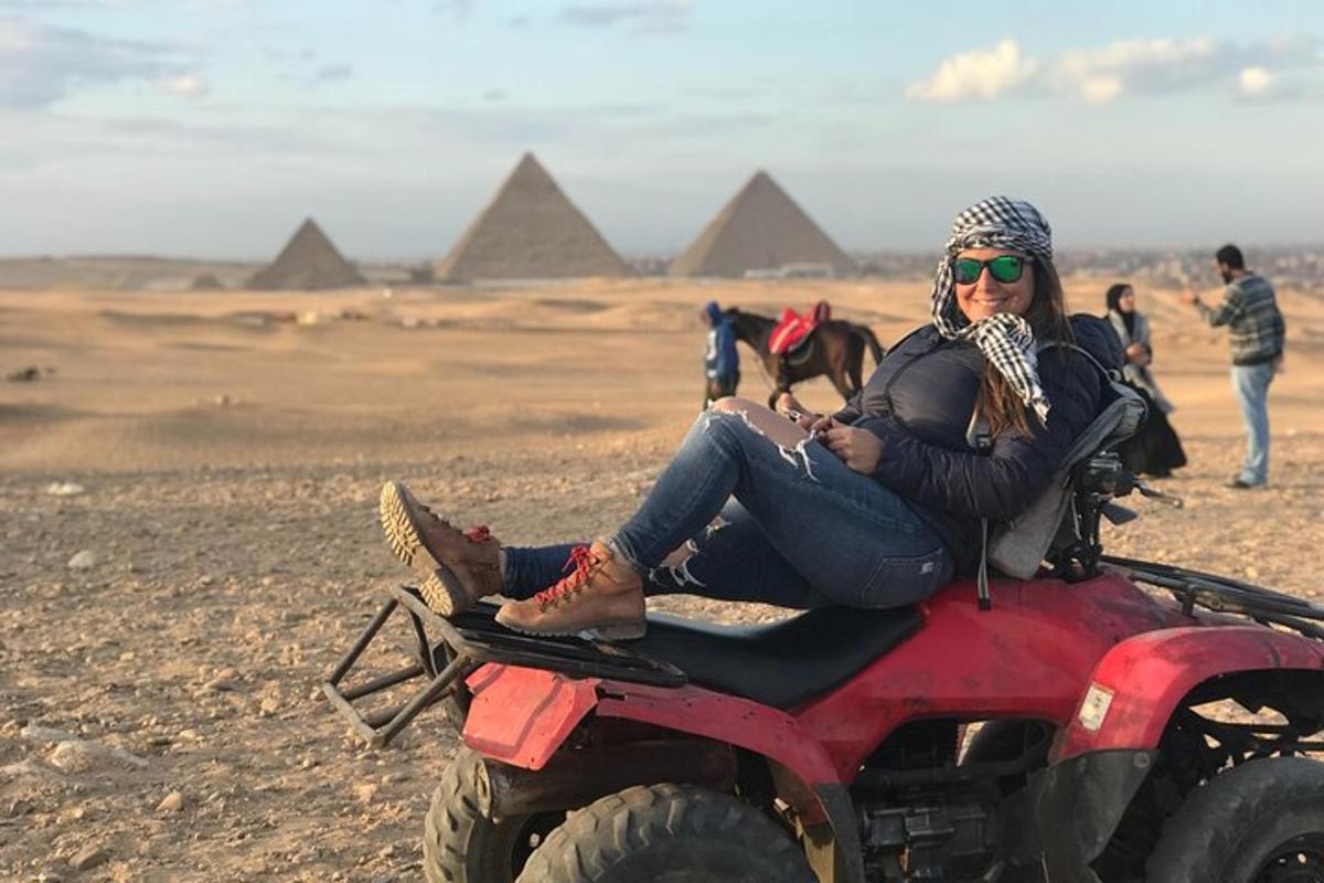 a woman sitting on the back of a atv in front oframids