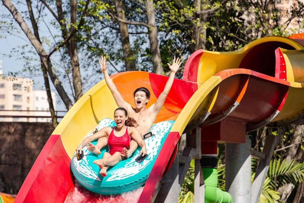 a man and a woman riding on a roller coaster