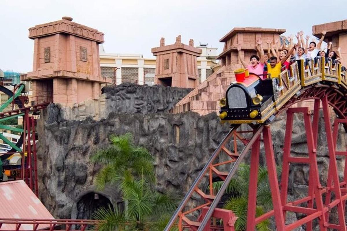 a group of people riding on a train on a roller coaster