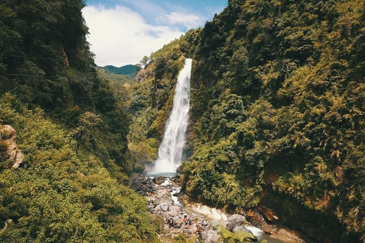 a waterfall in the middle of a mountain