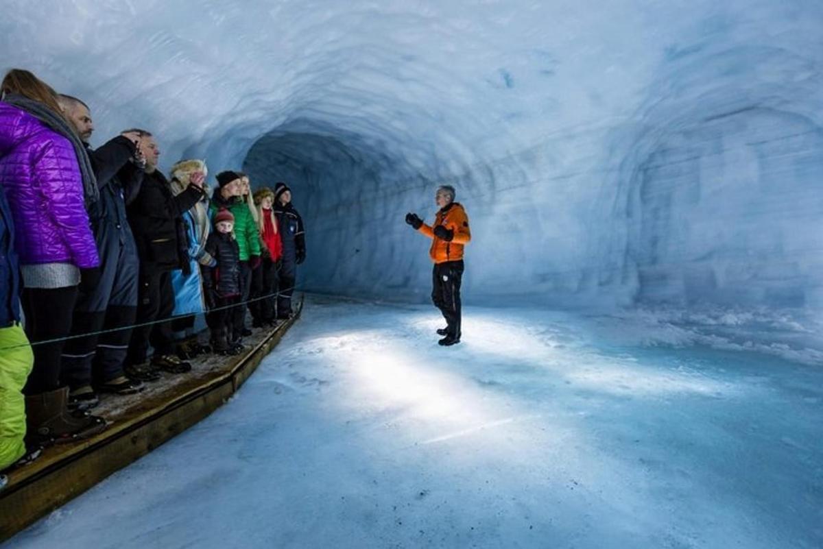 a man standing in a tunnel with a group of people