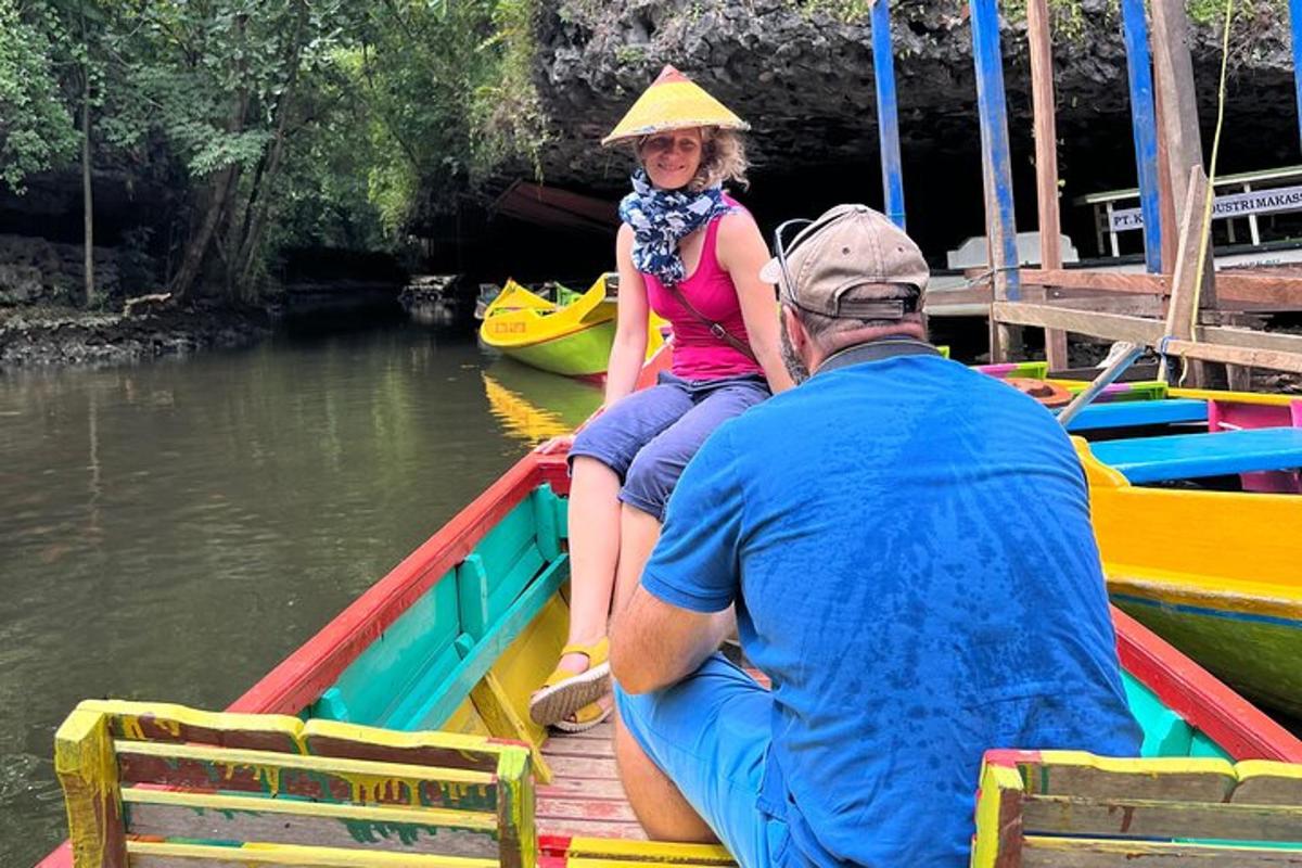 a man and a girl sitting on a boat on the water