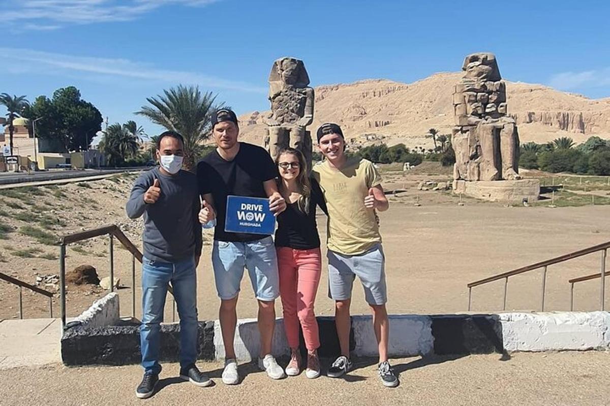a group of people holding up a sign in front ofartifacts