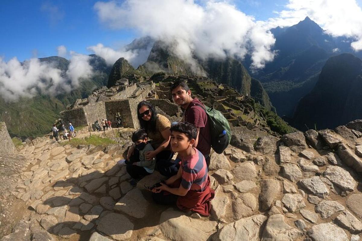 a group of people sitting on top of a mountain