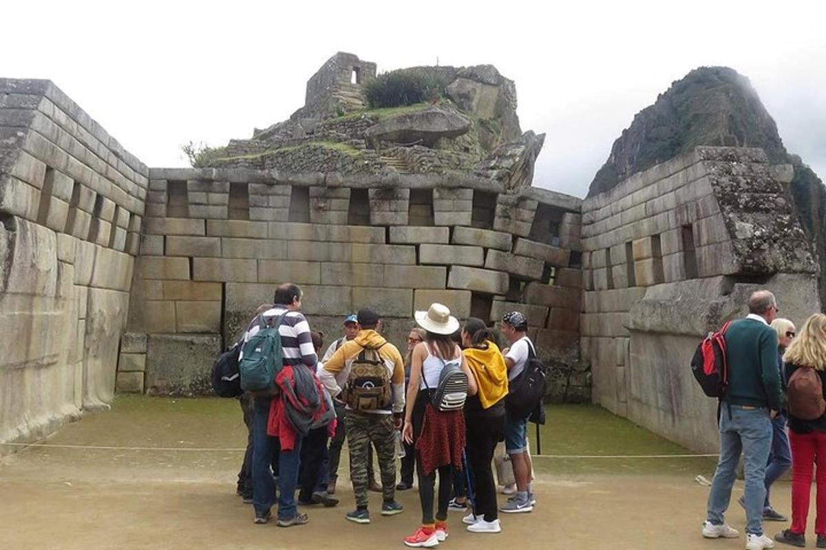 a group of people standing in front of a wall