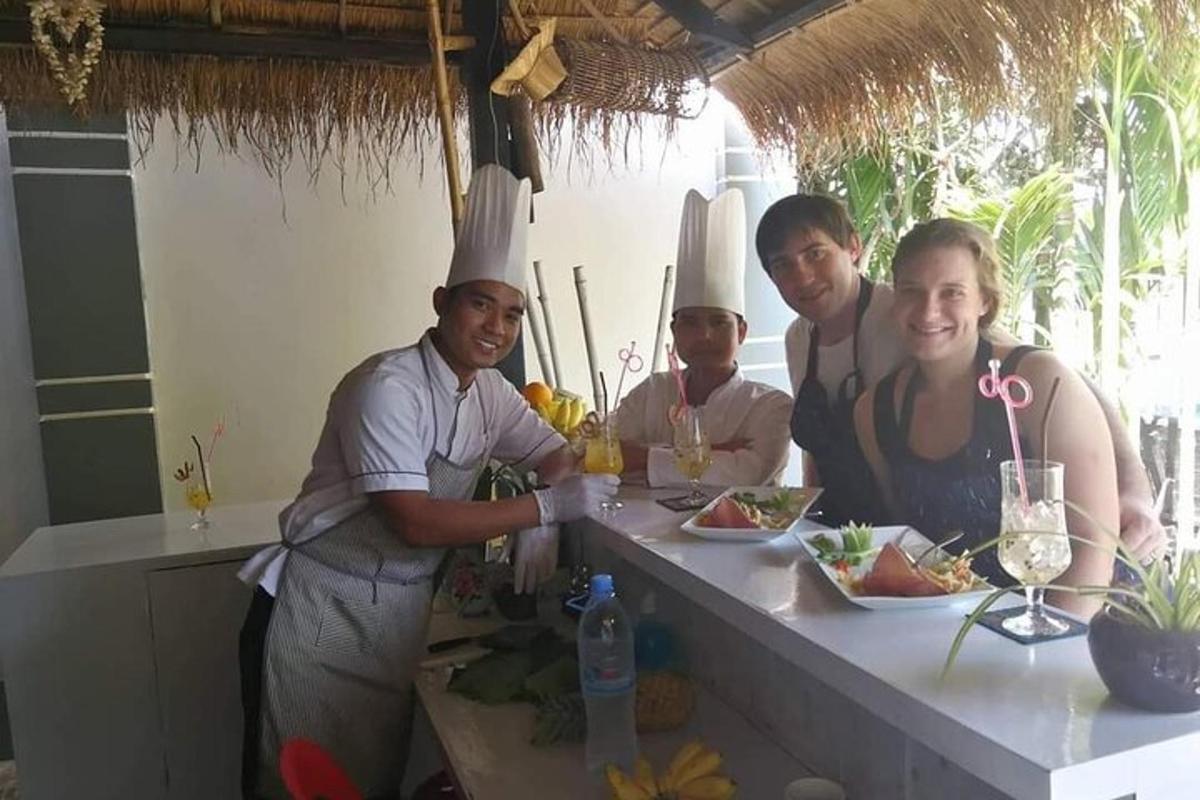 a group of people wearing chefs hats standing at a counter
