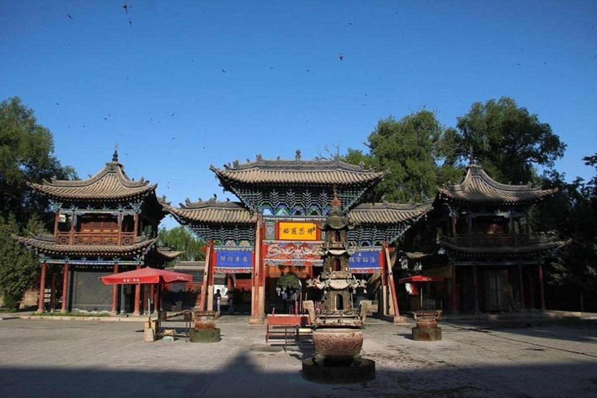 an asian style building with two buildings with roofs