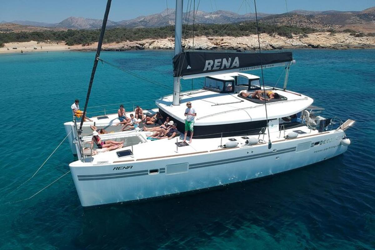 a group of people on a sail boat in the water