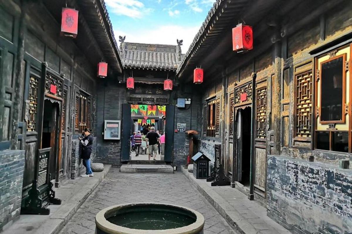 a courtyard of a building with a fountain in the middle