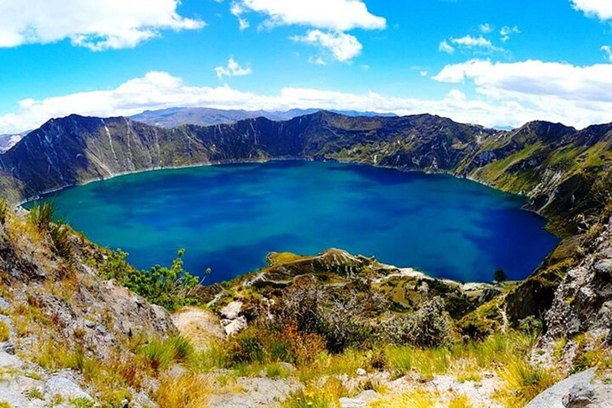 a view of a blue lake in the mountains