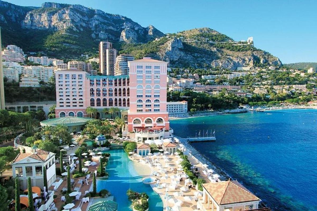 an aerial view of a resort near the water