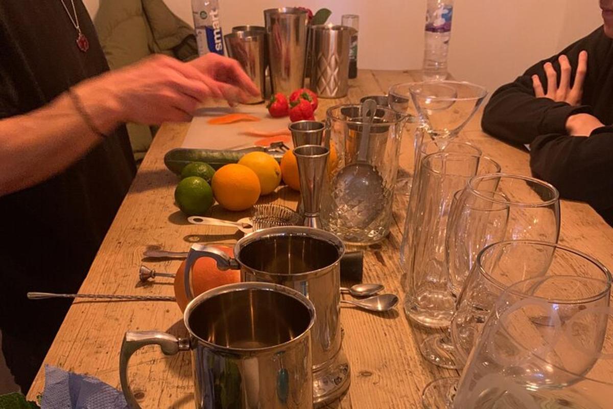 a wooden table with a bunch of glasses on it