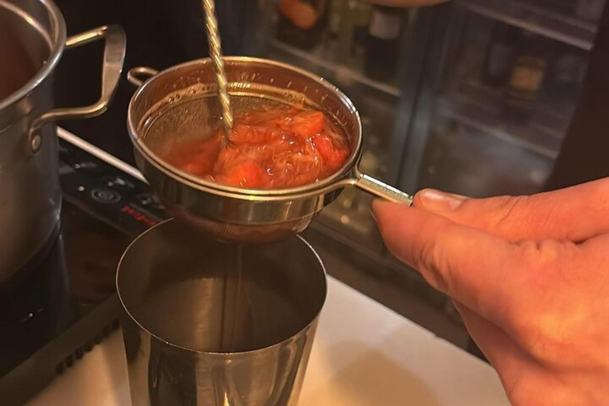 a person is stirring a pot of food