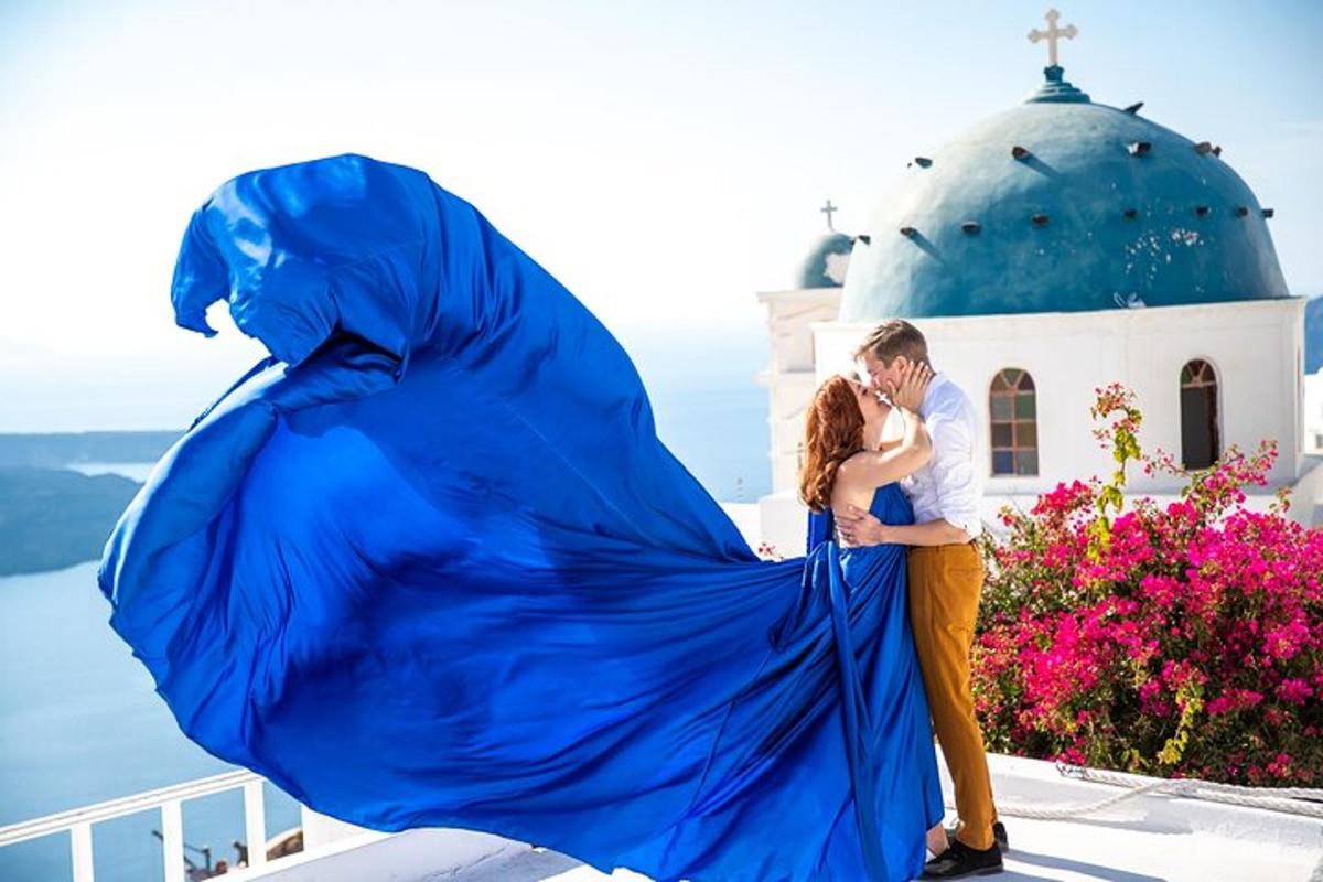 a man and a woman standing next to a blue sheet