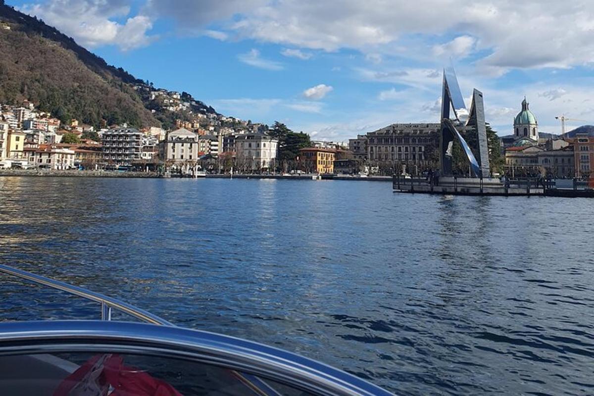 a boat on a river with a city and a bridge