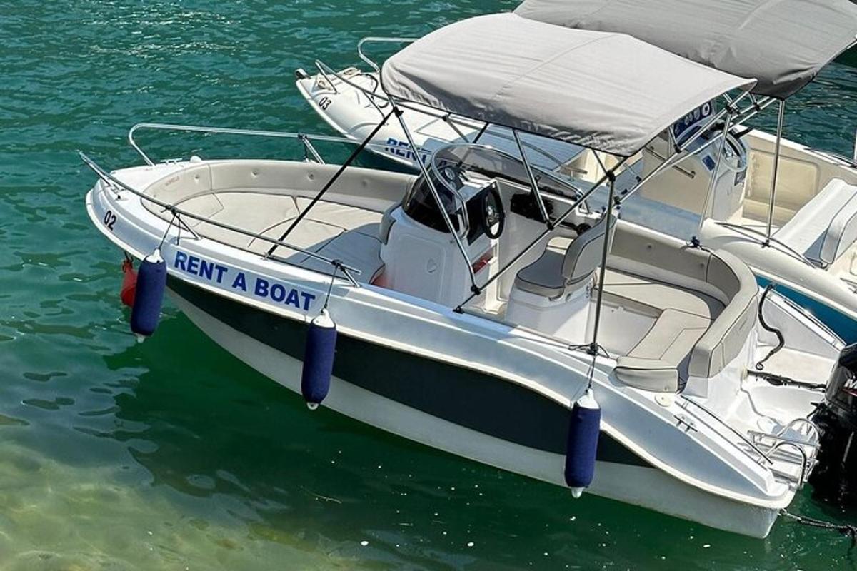a white boat with a sign that reads exit a boat