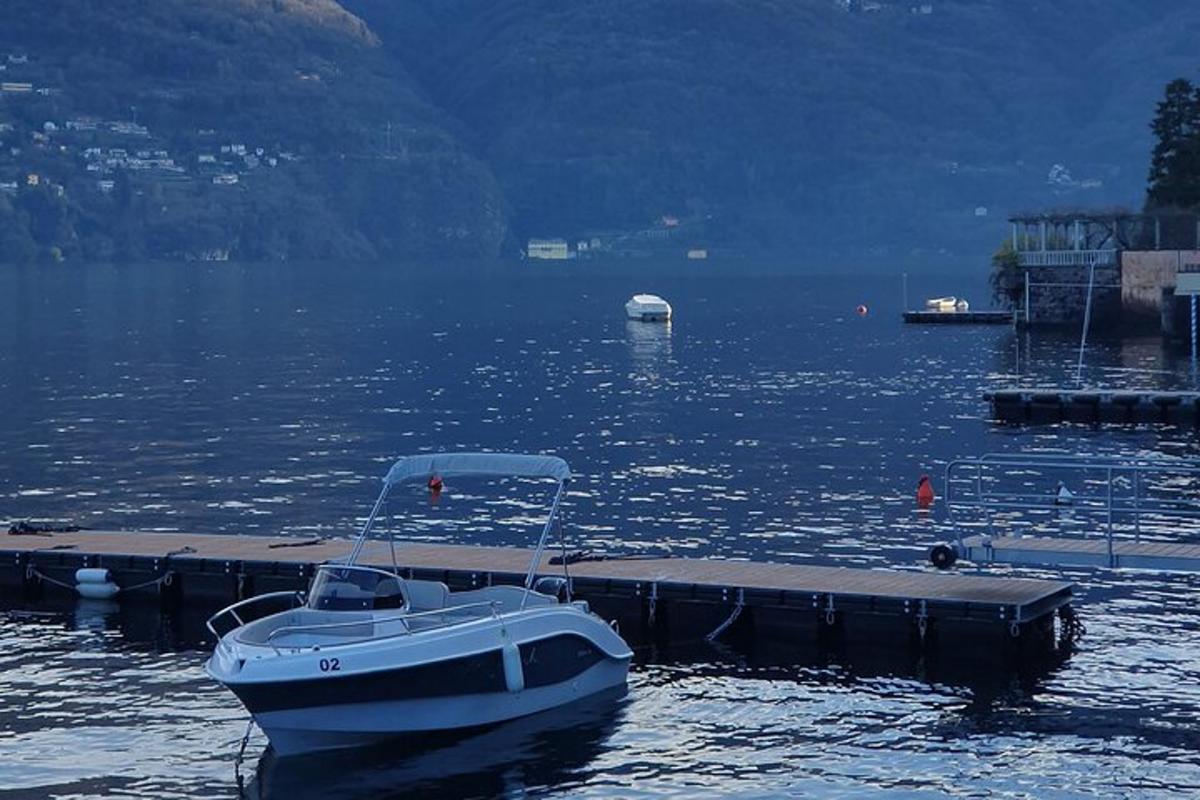 a boat is docked at a dock in the water