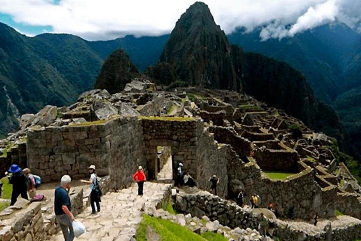 a group of people walking on a mountain