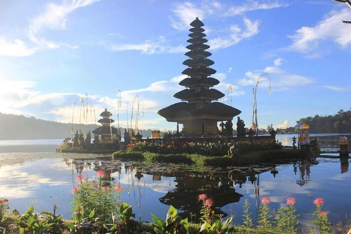 a pagoda in the middle of a body of water