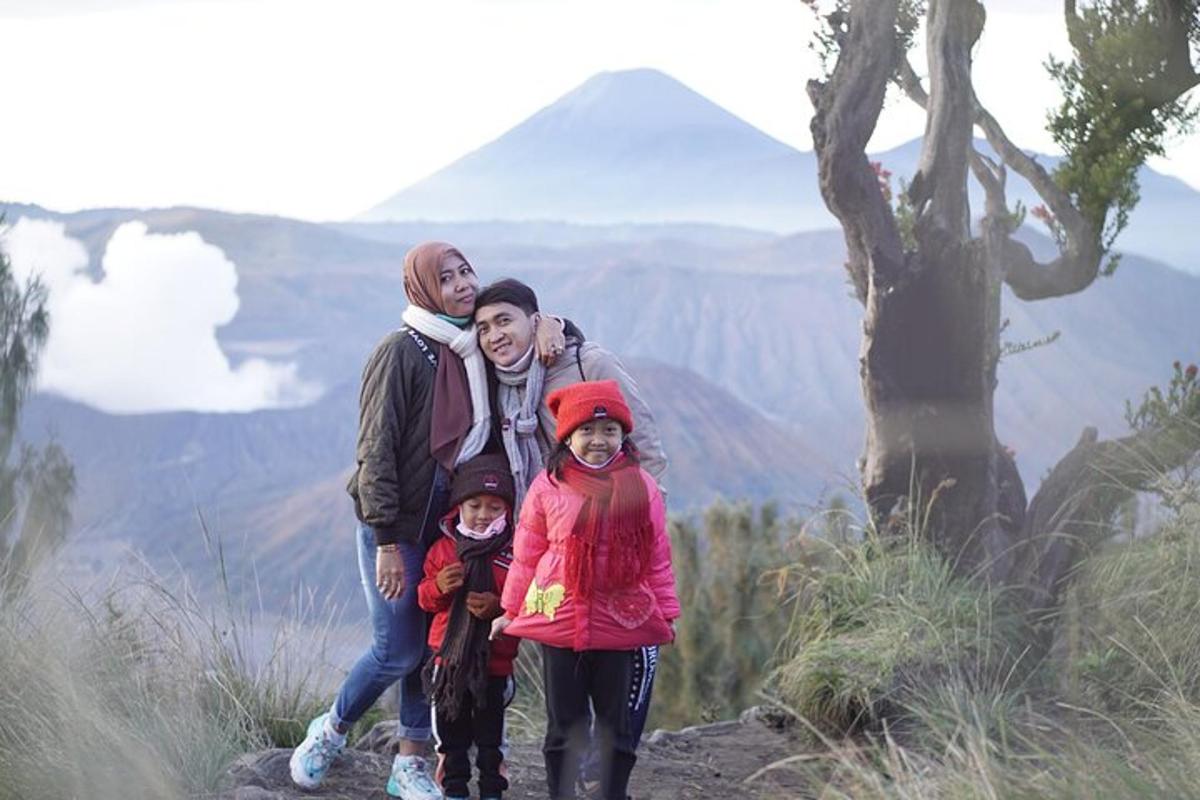 a family standing on top of a mountain