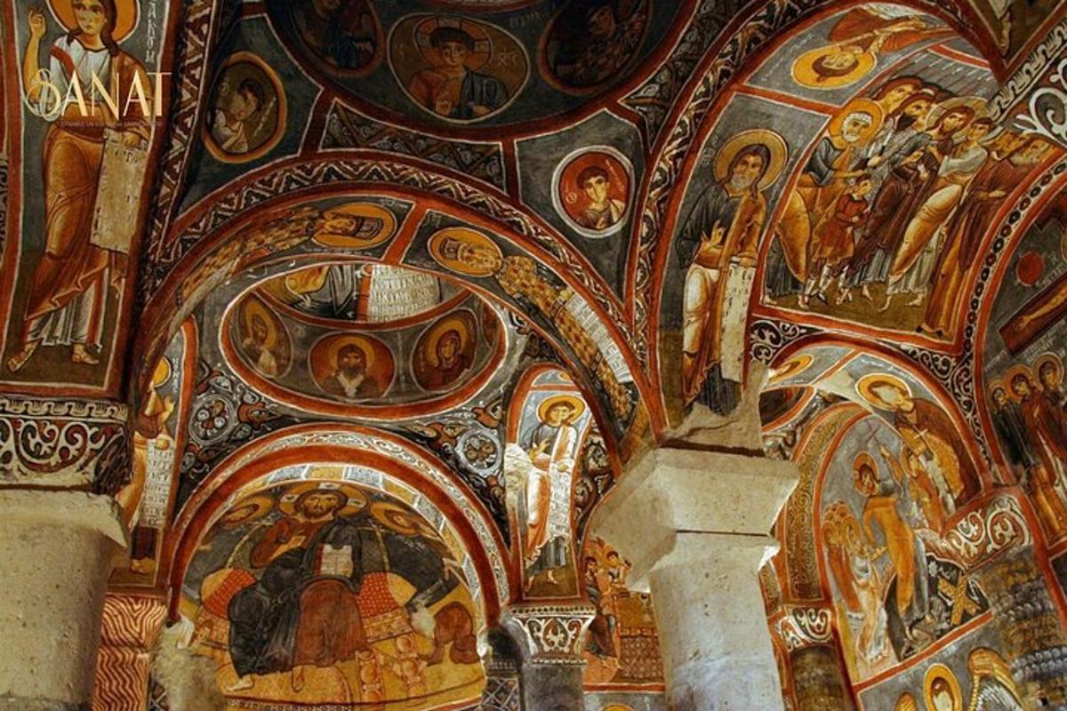 a room with mosaics on the ceilings of a church