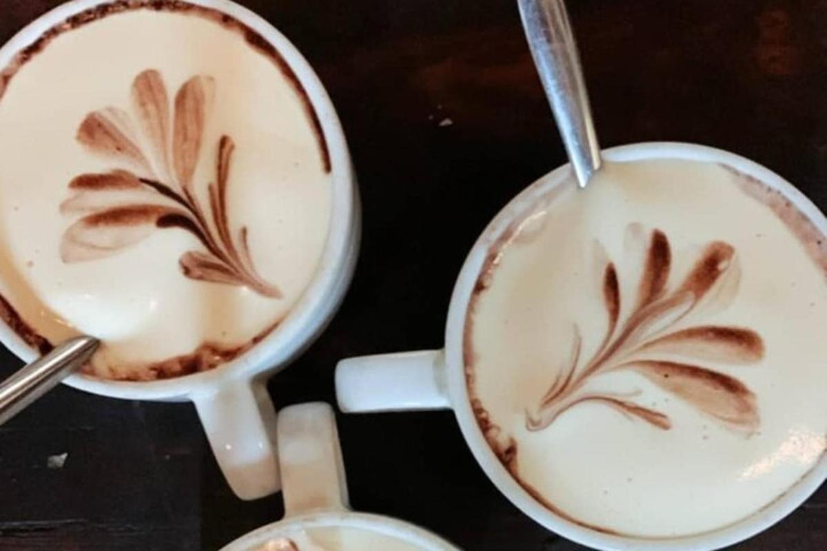 two cups of coffee sitting on a table