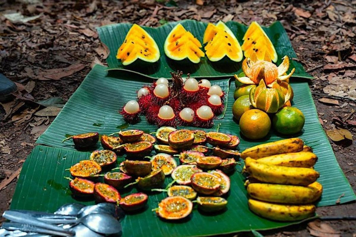 a green table with various fruits and vegetables on it