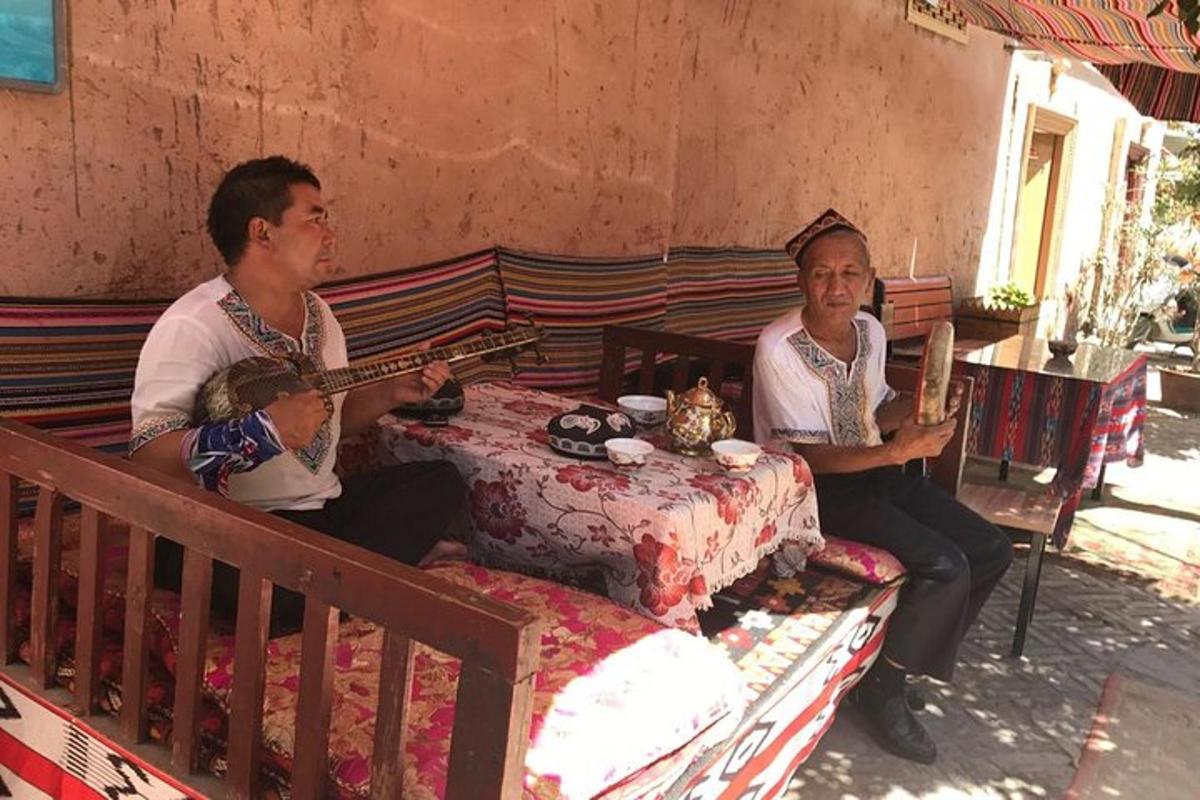 a group of three people sitting on a bed