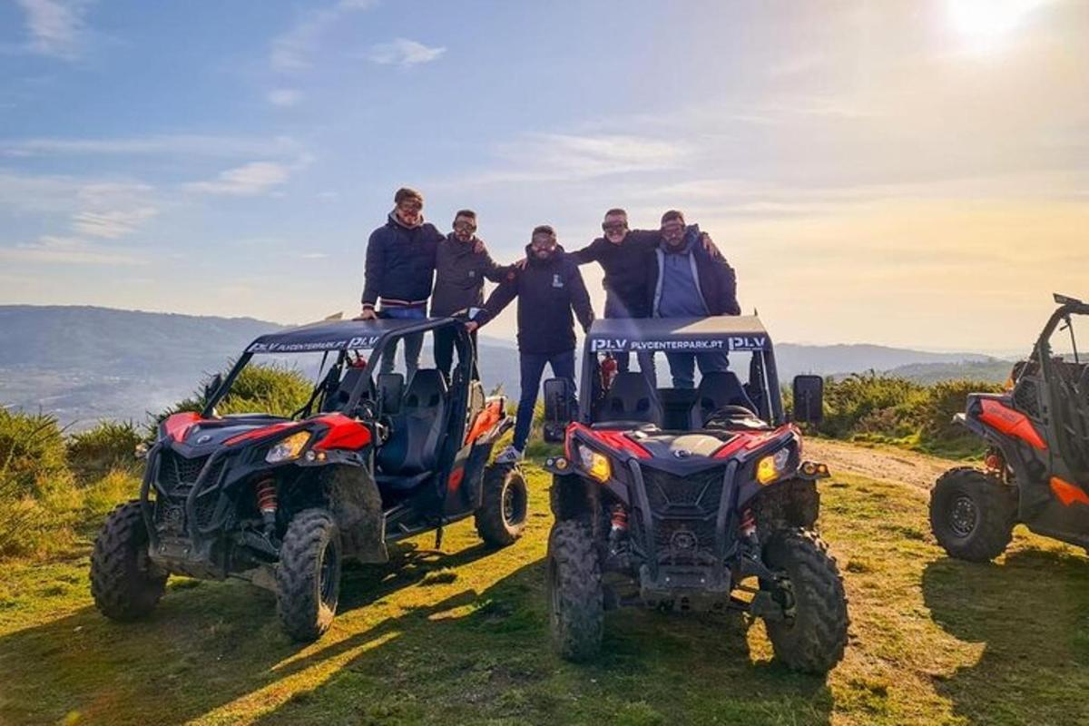 a group of people standing on the back of two atvs