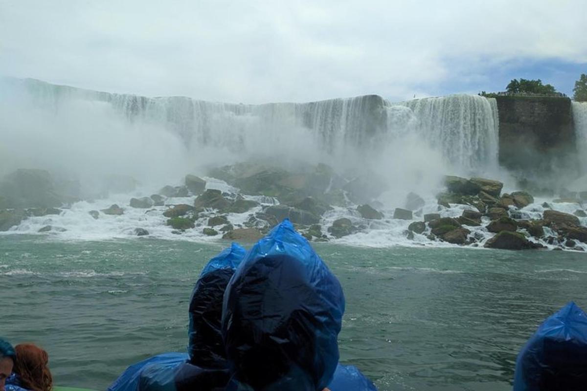 a group of people looking at a waterfall