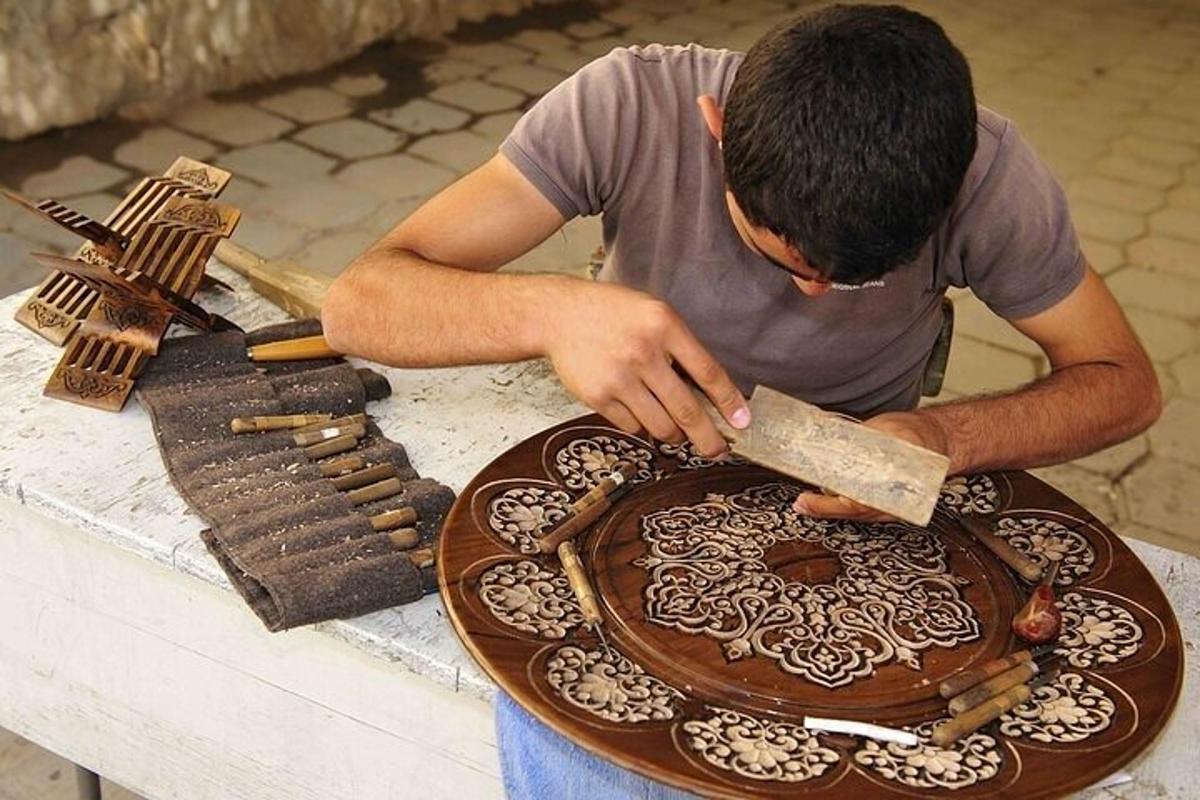 a man cutting a plate with a knife on a table