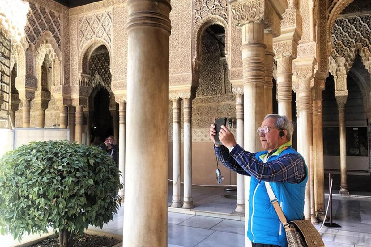 a man taking a picture of a building with a camera