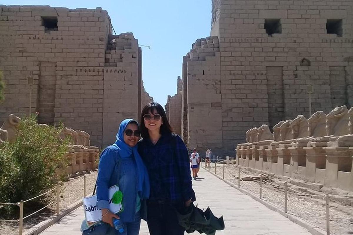 two women standing in front of a building