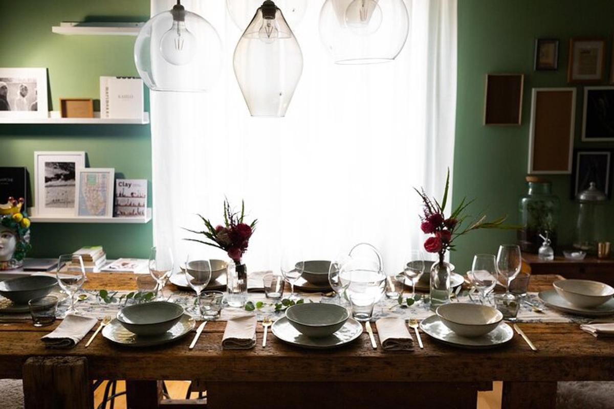 a wooden table with plates and glasses on it