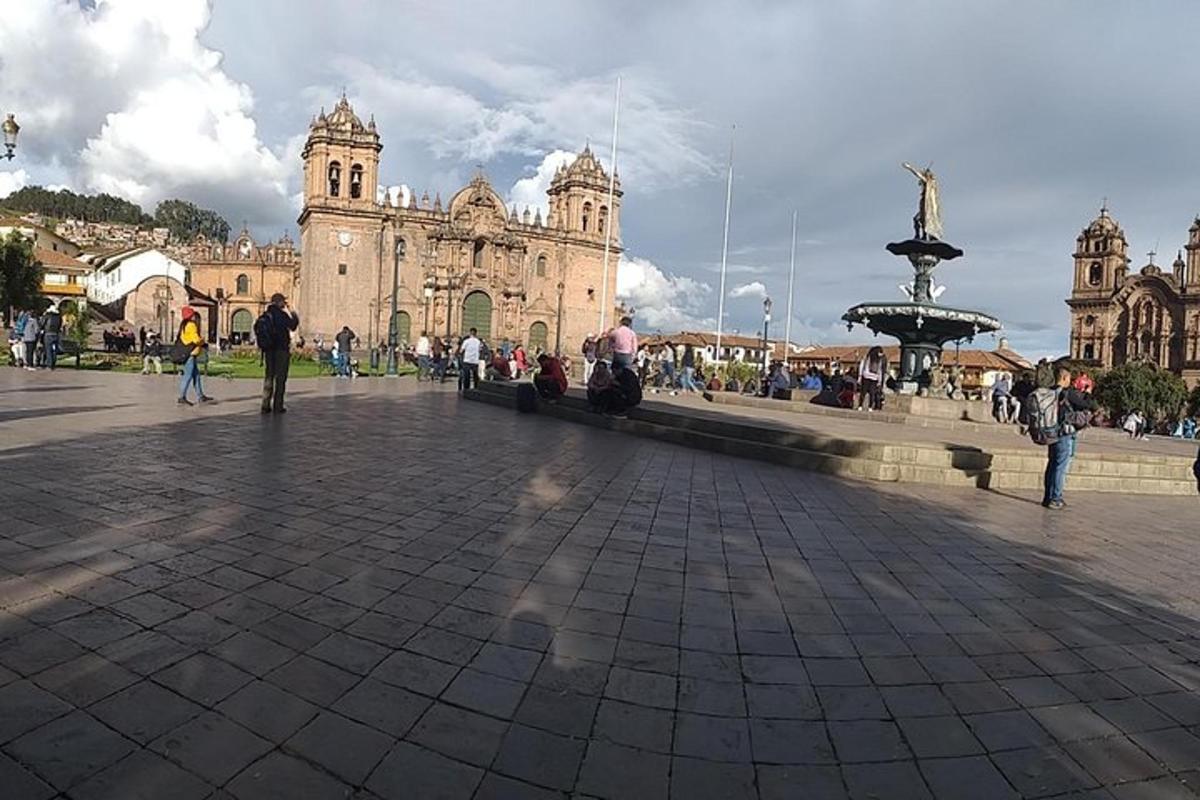 a group of people sitting on a bench in front of a building
