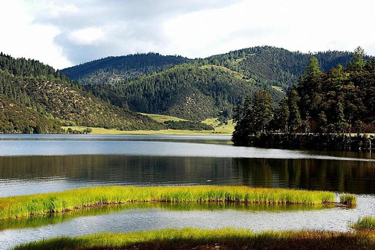 a view of a lake with mountains in the background
