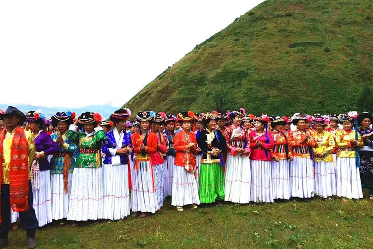 a group of people in traditional dress posing for a picture