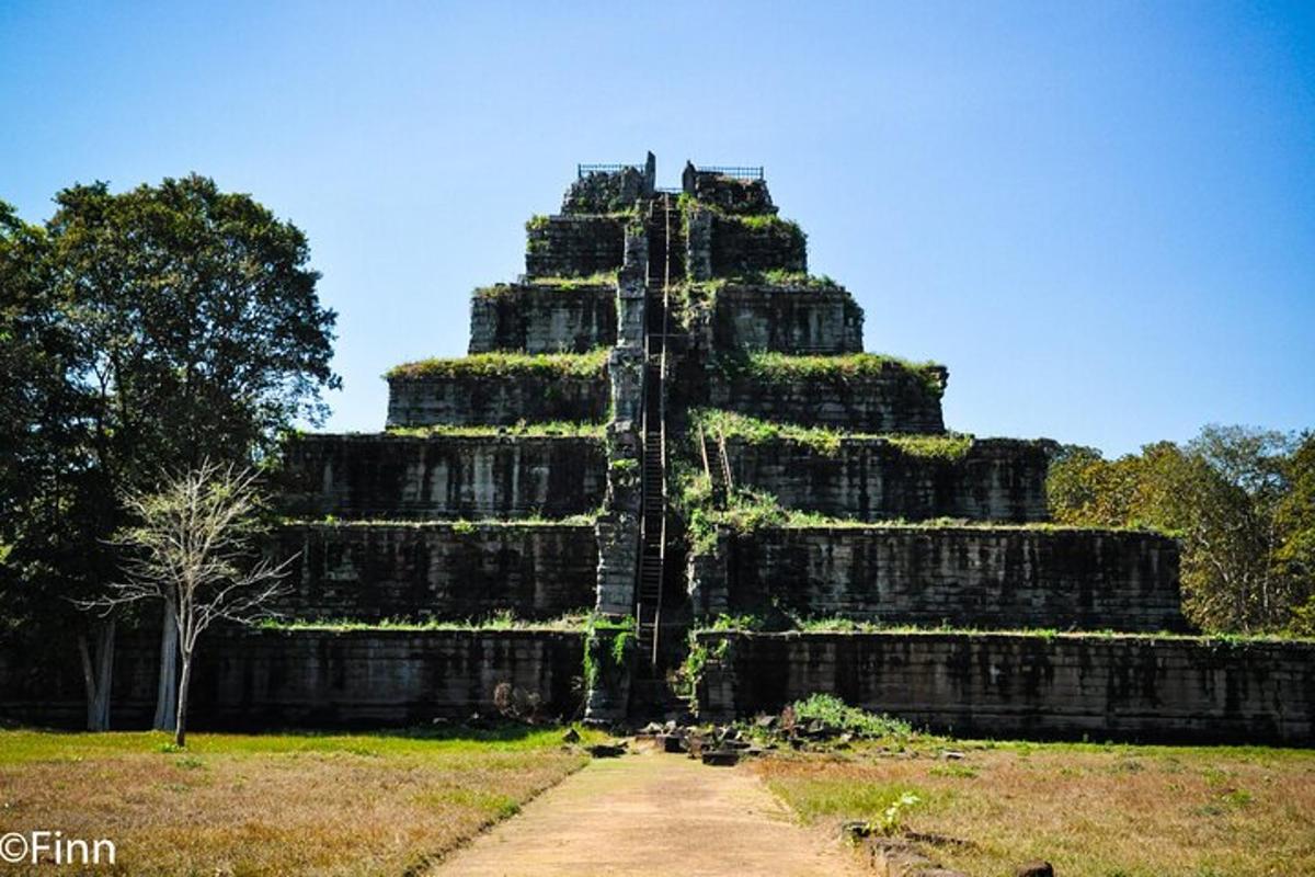 a large temple tower with a pathway in front of it