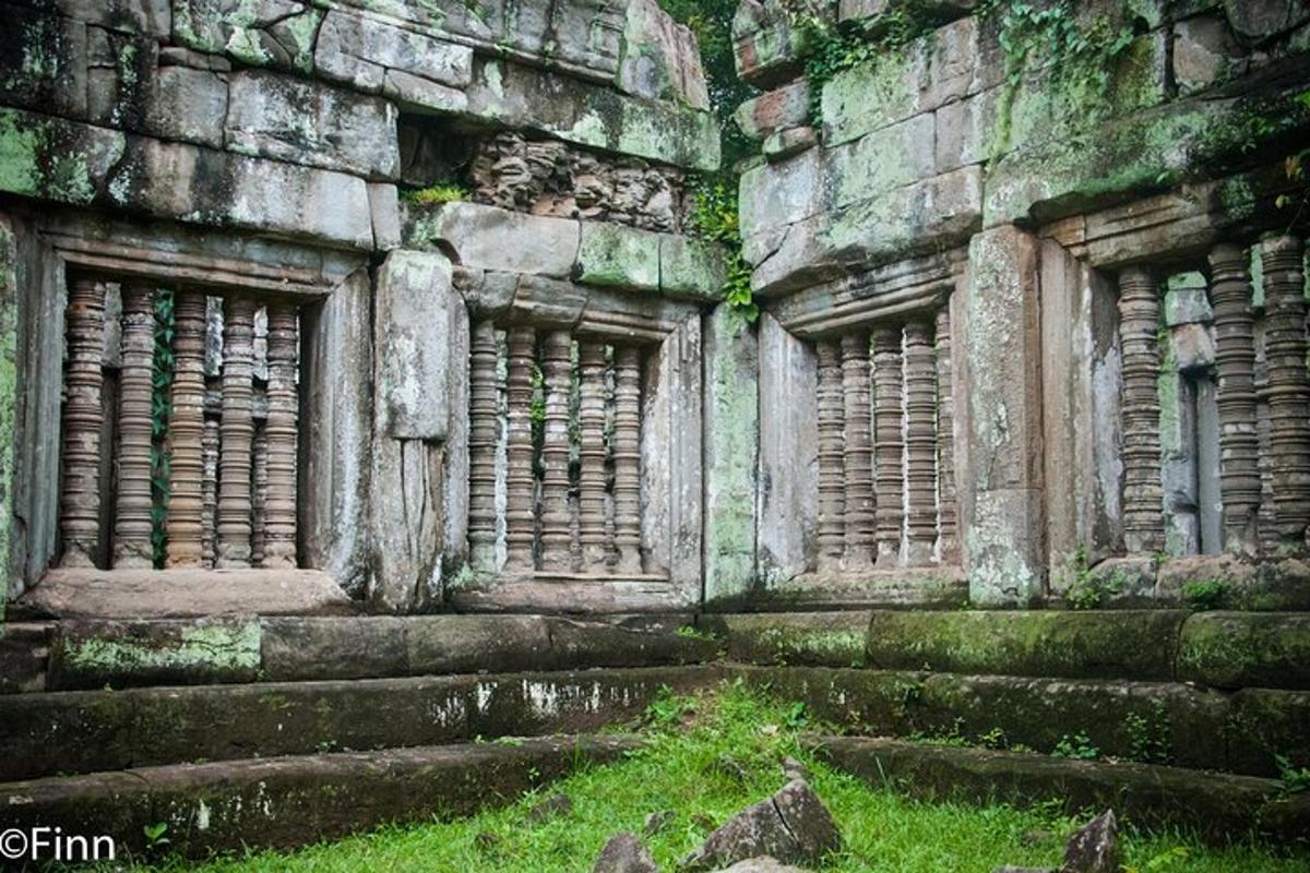 an old stone building with steps and windows