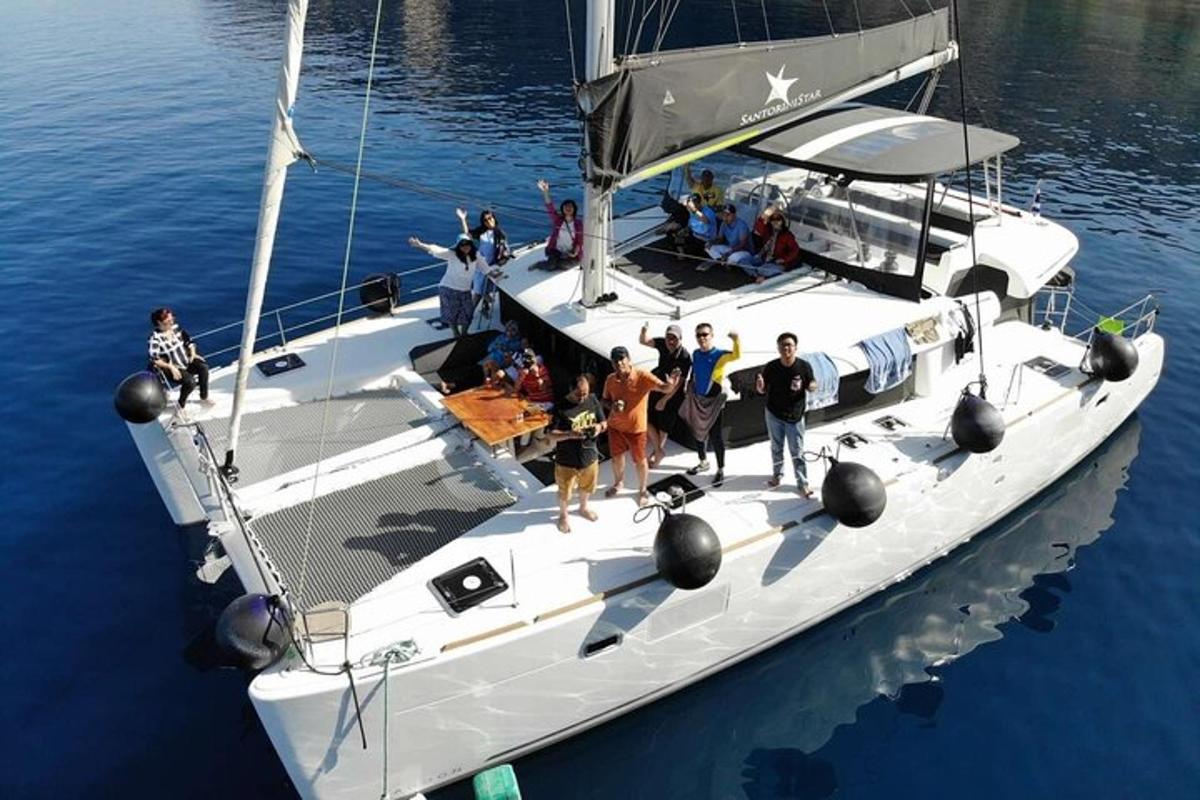 a group of people on a boat in the water