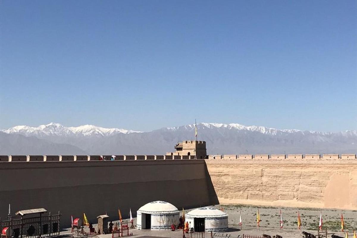 a view of a building with mountains in the background